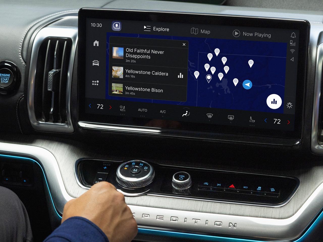 Autio map on a Ford Expedition touchscreen showing nearby audio stories around Yellowstone.